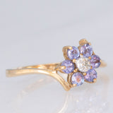 Anello contrarier con fiore in oro giallo 9K con tanzaniti (0.36ctw ca.) e diamante, anni ‘90
