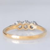 Trilogy antico in oro giallo e bianco 18K con diamanti di taglio brillante (0.40ctw ca.), anni ‘20/‘30