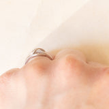 Anello vintage a nodo in oro bianco 9K con diamanti (0.06ctw ca.), anni ‘90