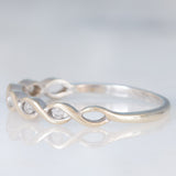 Anello intrecciato in oro bianco 9K con diamanti (0.05ctw ca.), anni ‘80