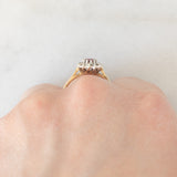 Anello a margherita vintage in oro giallo 9K con rubino (0.35ct ca.) e diamanti (0.06ctw ca.), anno 1984