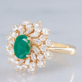 Anello ballerina vintage in oro giallo 14K con smeraldo (0.50ct ca.) e diamanti di taglio brillante e tapered (0.96ctw ca.), anni ‘80