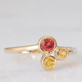 Trilogy astrattato in oro giallo 8K con topazi colorati (0.30ctw ca.), anni ‘70/‘80