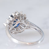Anello a margherita vintage in platino con zaffiro (1.27ct) e diamanti (0.43ctw), anni ‘80
