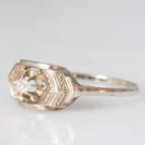 Solitario Art Déco in oro bianco 14K con diamante di taglio brillante (0.05ct ca.), anni ‘30