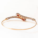 Braccialetto vintage con serpenti stilizzati in oro giallo 8K con granati (4ctw ca.), anni ‘60
