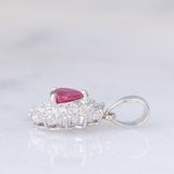 Ciondolo a margherita vintage in platino con rubino (0.52ct) e diamanti (0.45ctw)