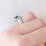 Anello a fiore vintage in platino con smeraldo (0.81ct) e diamanti (0.93ctw), anni ‘80
