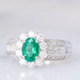 Anello a fiore vintage in platino con smeraldo (0.81ct) e diamanti (0.93ctw), anni ‘80
