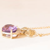 Collier vintage con catenina in oro giallo 18K e con ciondolo in oro giallo e bianco 14K con ametista (4.40ct ca.) e diamanti, anni ‘60/‘70
