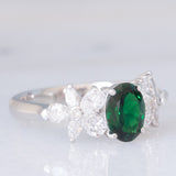 Anello vintage in platino con tsavorite (0.94ct) e due fiori di diamanti (0.78ctw), anni ‘90/anni ‘2000