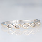 Anello intrecciato in oro bianco 9K con diamanti (0.05ctw ca.), anni ‘80