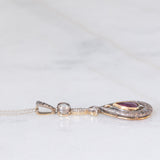 Collier vintage in stile antico con catenina in oro bianco 18K e con ciondolo in oro giallo 18K e argento con rubino (0.60ct ca.) e diamante di taglio rosetta (0.10ct ca.), anni ‘50/‘60