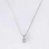 Collana vintage in oro bianco 10K con punto luce con spinello azzurro e diamante, anni ‘90/anni ‘2000