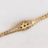 Braccialetto vintage in oro giallo 8K con granati (0.90ctw ca.), anni ‘50