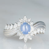 Anello a margherita vintage in platino con zaffiro stellato (0.71ct) e diamanti (0.27ctw), anni ‘80/‘90