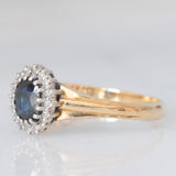 Anello a margherita vintage in oro giallo 9K con zaffiro (0.70ct ca.) e diamanti (0.08ctw ca.), anno 1991