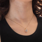 Ciondolo vintage in oro giallo e bianco 14K con topazio azzurro (2ct ca.) e diamanti (0.03ctw ca.), anni ‘70