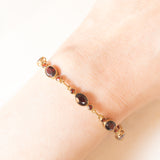 Braccialetto semirigido vintage in oro giallo 8K con granati (7ctw ca.), anni ‘60/‘70