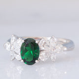 Anello vintage in platino con tsavorite (0.94ct) e due fiori di diamanti (0.78ctw), anni ‘90/anni ‘2000