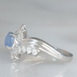Anello a margherita vintage in platino con zaffiro stellato (0.71ct) e diamanti (0.27ctw), anni ‘80/‘90