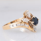 Anello a fiore vintage in oro giallo 14K con zaffiro (0.50ct ca.) e diamanti (0.90ctw ca.), anni ‘70/‘80