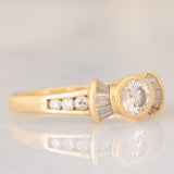 *RISERVATO* Anello “ballerina” in oro giallo 18K con diamanti di taglio brillante e di taglio tapered (0.71ctw ca.), anni ‘80