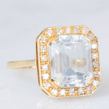 Anello a margherita vintage in oro giallo 14K con acquamarina (3.30ct ca.) e diamanti (0.22ctw ca.), anni ‘70