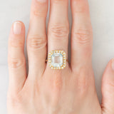 Anello a margherita vintage in oro giallo 14K con acquamarina (3.30ct ca.) e diamanti (0.22ctw ca.), anni ‘70