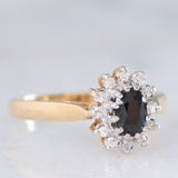 Anello a margherita vintage in oro giallo 9K con zaffiro (0.45ct ca.) e diamanti (0.10ctw ca.), anni ‘80