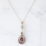 Collier vintage in stile antico con catenina in oro bianco 18K e con ciondolo in oro giallo 18K e argento con rubino (0.60ct ca.) e diamante di taglio rosetta (0.10ct ca.), anni ‘50/‘60