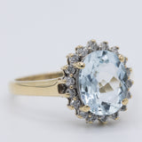 Anello a margherita vintage in oro giallo 9K con acquamarina (2ct ca.) e diamanti (0.18ctw ca.), anni 2000