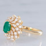 Anello ballerina vintage in oro giallo 14K con smeraldo (0.50ct ca.) e diamanti di taglio brillante e tapered (0.96ctw ca.), anni ‘80