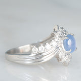 Anello a margherita vintage in platino con zaffiro stellato (0.71ct) e diamanti (0.27ctw), anni ‘80/‘90