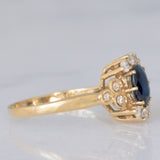 Anello a margherita vintage in oro giallo 14K con zaffiro (0.70ct ca.) e diamanti (0.20ctw ca.), anni ‘80