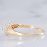 Anello a fiore vintage in oro giallo e bianco 14K con diamanti di taglio brillante (0.55ctw ca.), anni ‘80