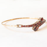 Braccialetto vintage con serpenti stilizzati in oro giallo 8K con granati (4ctw ca.), anni ‘60