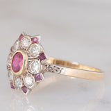 Anello a fiore antico in oro giallo 14K e argento con rubini (0.40ctw ca.) e diamanti di taglio vecchia miniera (0.65ctw ca.), primi del ‘900