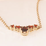 Collier vintage in oro giallo 8K con granati (1ctw ca.), anni ‘60/‘70