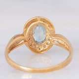 Anello a margherita in oro giallo 9K con zircone azzurro (1.83ct ca.) e zirconi bianchi
