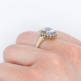 Anello a margherita vintage in oro giallo 9K con acquamarina (2ct ca.) e diamanti (0.18ctw ca.), anni 2000
