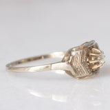 Solitario Art Déco in oro bianco 14K con diamante di taglio brillante (0.05ct ca.), anni ‘30
