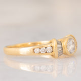 *RISERVATO* Anello “ballerina” in oro giallo 18K con diamanti di taglio brillante e di taglio tapered (0.71ctw ca.), anni ‘80