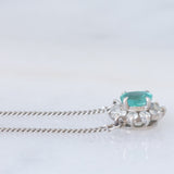 Collier vintage in platino con ciondolo a margherita con smeraldo (0.35ct) e diamanti (0.23ctw)