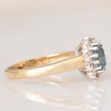 Anello a margherita vintage in oro giallo 9K con topazio azzurro (0.55ct ca.) e diamanti (0.05ctw ca.)
