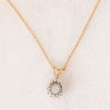 Collana vintage con catenina in oro giallo 9K e con ciondolo a margherita in oro giallo 9K con acquamarina (0.30ct ca.) e diamanti (0.06ctw ca.)