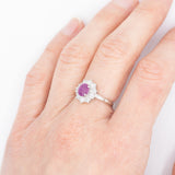 Anello a margherita vintage in platino con rubino stellato (1.35ct) e diamanti (0.66ctw ca.), anni ‘90