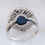 Anello a margherita vintage in platino con zaffiro (4.74ct) e diamanti (0.86ctw), anni ‘80