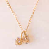 Collana vintage con catenina in oro giallo 9K e ciondolo in oro giallo 10K con tanzaniti (1.30ctw ca.) e diamanti