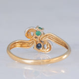 Toi et Moi vintage in oro giallo 18K con zaffiro (0.09ct ca.), smeraldo (0.06ct ca.) e diamanti, anni ‘70/‘80